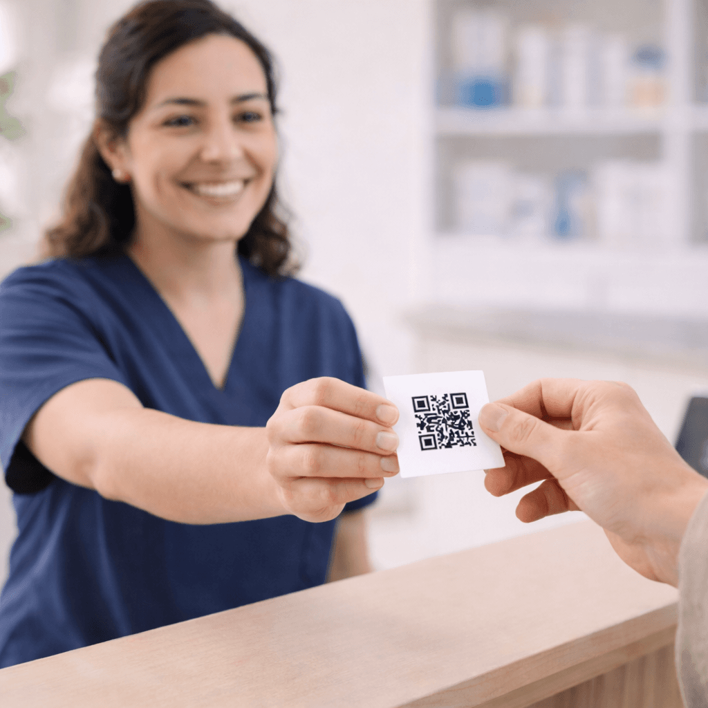 A QR code sticker at a clinic's front desk for easy rollout